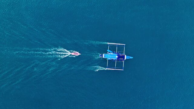 Blue tropical waters surround traditional banca during cinematic evening voyage