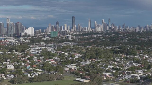 Overlooking Gold Coast Skyline Across Coastal Suburb Of Labrador In Queensland, Australia. Aerial Shot
