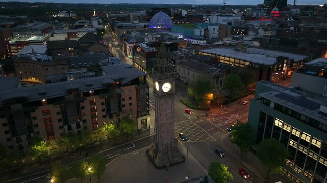 High rotating aerial video of The Albert Clock in Belfast City Centre, Northern Ireland in the UK at night. Produced in 4K and with Rec709 color.