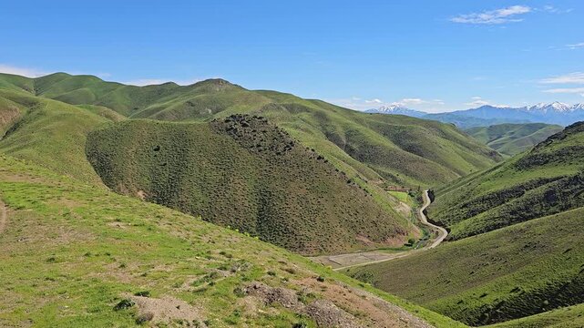 Winding dirt road through a green mountain valley under a clear blue sky, showcasing the beauty of a peaceful rural landscape in spring.
📍 Marivan, Kurdisatn, Iran 