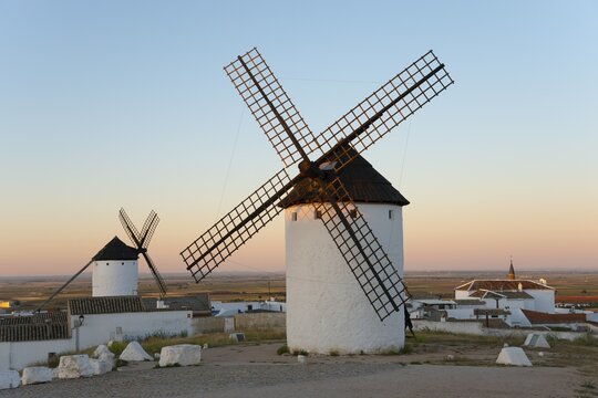 White windmills stand in a rural landscape under a gentle morning sky, Campo de Criptana, Ciudad Real province, Castilla-La Mancha, Don Quixote Route, Spain