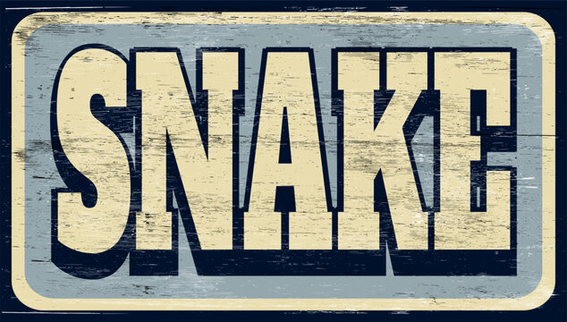 Aged and worn snake sign on wood