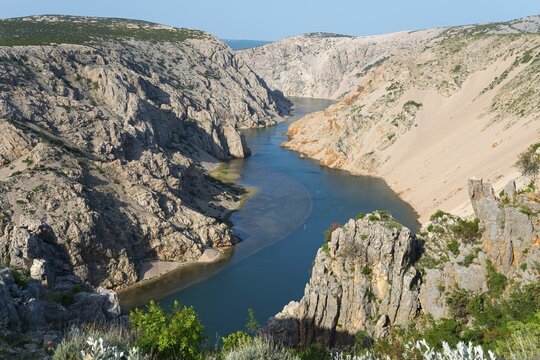 A river flows through a deep, rocky gorge with steep cliffs and clear watercourses, Pariževacka Glavica, Parizevacka, location of Karl May films, Zrmanja River, Jasenice, Zadar County, Croatia