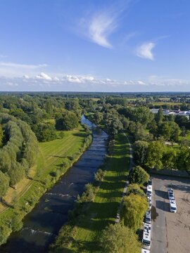 Aerial view of a river with surrounding green landscape and blue sky, aerial view, motorhome site, river Vechte, Sch&uuml;ttorf, Lower Saxony, Germany