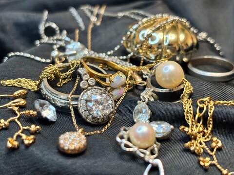 A glamorous jewelry box style collection of gold and silver gems.
