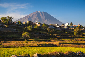 Panoramic sunset view of Misti volcano behind ancient agricultural terraces in Paucarpata, Arequipa, Peru © Helard