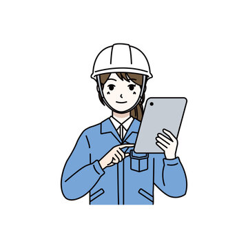 Female worker with safety helmet checking tablet device