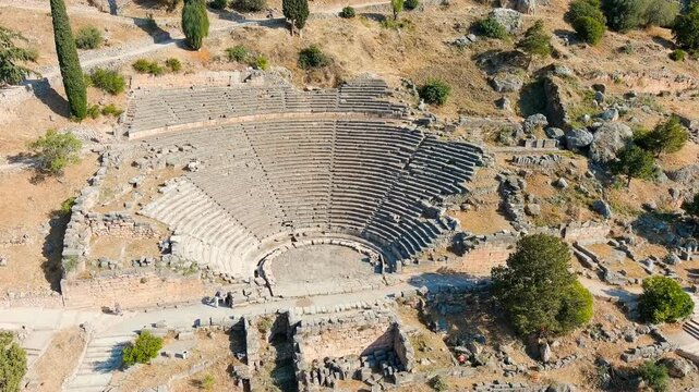 Delphi, Greece. Ruins of the ancient city of Delphi. Sunny weather in the morning, Summer. Drone footage, Departure of the camera