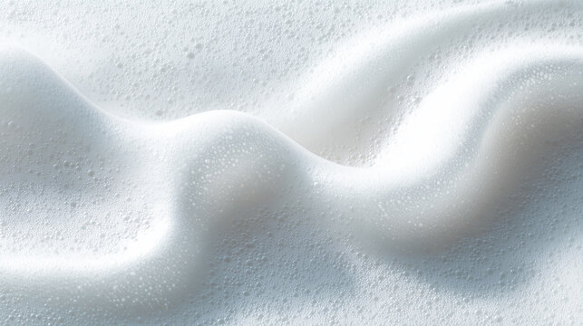 Smooth cosmetic mousse foam smear, airy and fluffy white texture with glossy highlights, soft and light appearance, isolated on clean white background, minimal skincare aesthetic