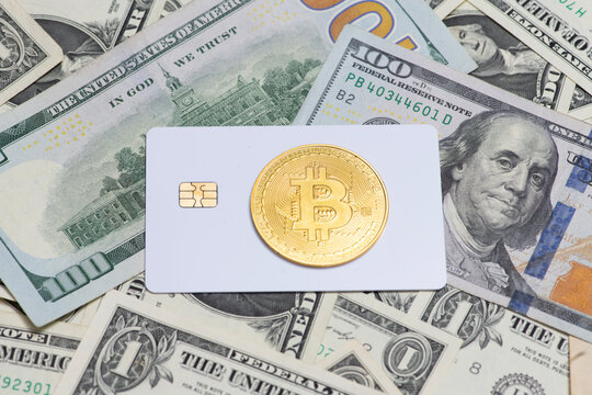Bitcoin coin on credit card over dollars bills. Bitcoin crypto currency investment finance. Bitcoin blockchain banking technology concept. Bitcoin economy symbol with savings money.