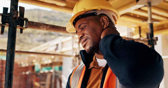 Construction, injury and black man with neck pain for accident, stress and tension at building site. Architecture, engineering and person with pressure for fibromyalgia, muscle sprain and overworked