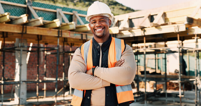 Crossed arms, happy and portrait of African man on construction site for infrastructure career. Architecture, contractor and person with ppe for safety compliance, renovation project and building