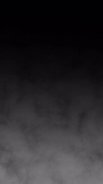 Vertical realistic moving fog smoke overlay alpha channel for atmospheric video transitions and cinematic scene enhancements.