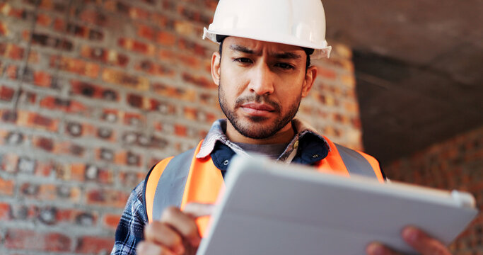 Construction, confused and man on tablet for building report, site inspection and mistake. Architecture, low angle and person on digital tech with error for renovation project, remodeling and concern