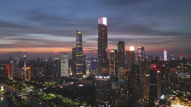 Aerial View of Guangzhou Skyline at Sunset with River Reflection