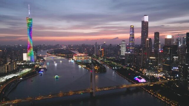 Aerial View of Guangzhou Skyline at Dusk with Illuminated Buildings and River
