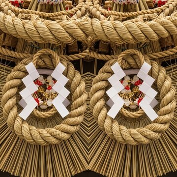 Traditional shimenawa straw rope decoration with shide paper streamers at Gion Matsuri festival in Kyoto Japan.