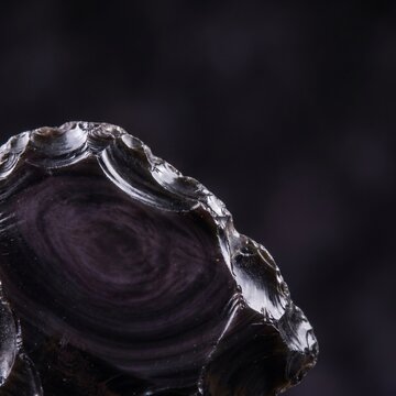 Macro of Natural Obsidian Volcanic Glass with Conchoidal Fracture