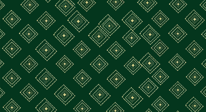 Emerald green textile pattern with golden diamond shapes featuring ethnic ikat embroidery style and tribal folk art influence for luxury fabric decoration.