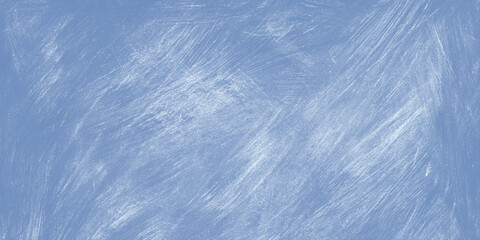 Blue chalkboard texture with white scratched marks on a smooth surface for design and education backgrounds © Daiyan