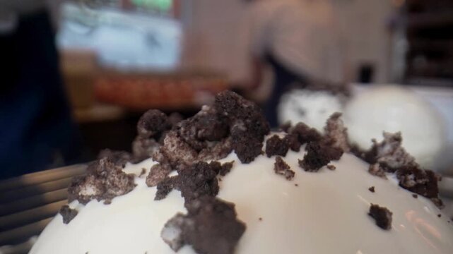 Blurry white cake with chocolate.