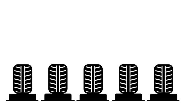 A horizontal row of four car tires with detailed tread patterns displayed side by side, representing automotive wheel inventory or tire shop selection