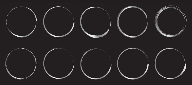 Set of ten silver brush circle frames on dark background elements