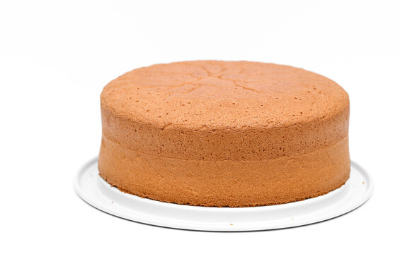 Baked round sponge cake for a birthday cake