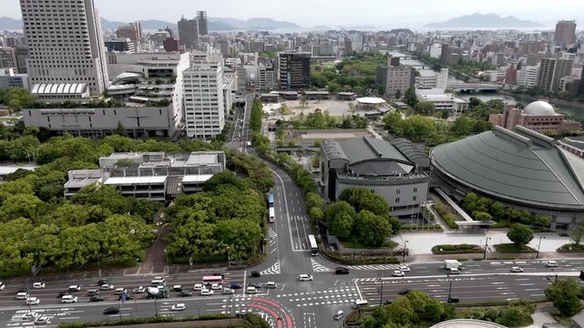 Aerial Flight Over Central Hiroshima Cityscape and Ota River Delta Japan