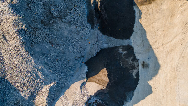 Ore Deposits and Crushed Rock Stockpiles in Mining Quarry Site, Aerial View