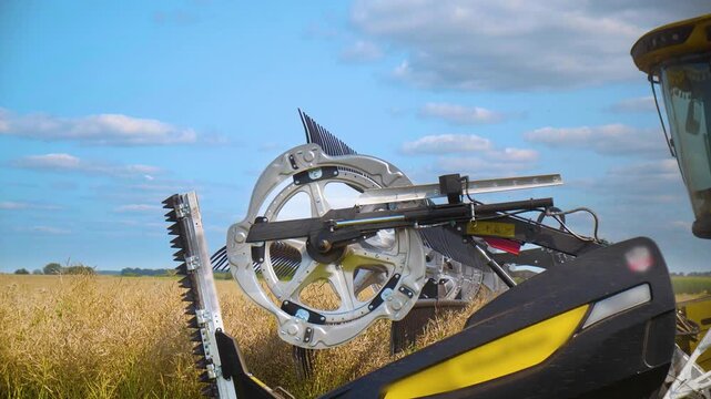Close-up of a combine harvester header reel on a sunny field, agriculture m&fnof;&ne;achinery.