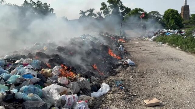 Burning trash on the roadside.