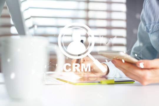 CRM strategy session with digital tools and client management focus in a modern office setting