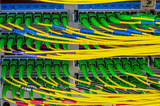 optical ports and cables in telecommunication rack of a server station