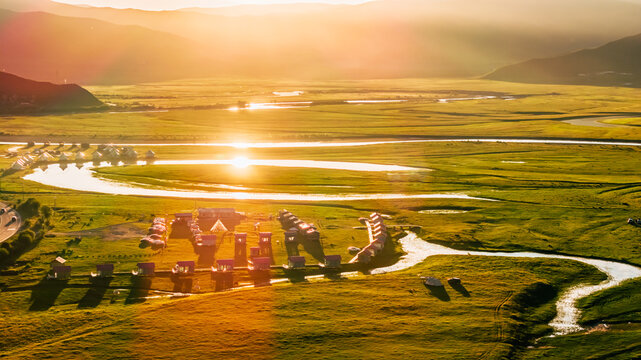 Sunset and bead-like sun spots over the White River with grassland scenery at dusk in Hongyuan County, Aba, Sichuan, China