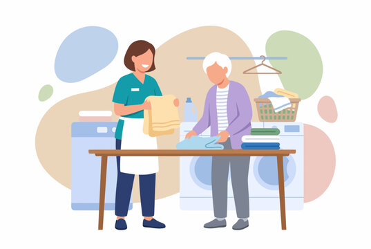Caregiver assisting elderly woman with laundry tasks
