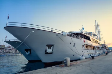Beautiful view with a large tourist ship docked at the harbor of the old town of Trogir, Croatia © Jess_Ivanova