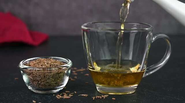 Jeera water or cumin water served in a cup.