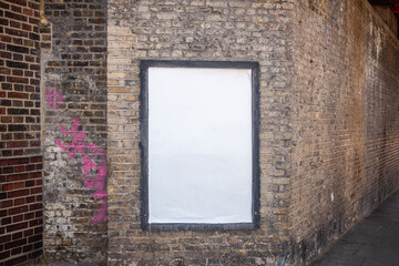 LONDON - Blank advertising hoarding mockup on old brick railway bridge © William