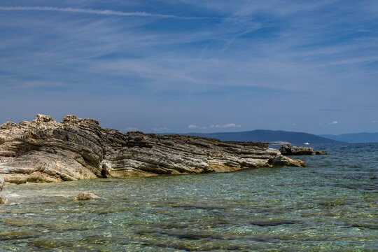 Blonde Woman Sunbathing on Empty &Scaron;i&scaron;an Beach Near Ližnjan, Croatia