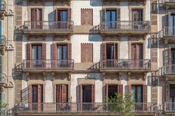 Obraz premium Residential Building Facade, Barcelona, Balconies and Wooden Shutters, Traditional Sgraffito Decoration