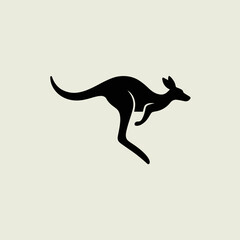 Black silhouette of a kangaroo jumping. © Virelix