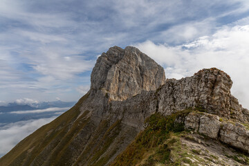 Fototapeta premium Scenic alpine mountains near the Col de la Colombière in the Bornes-Aravis massif with green meadows and rugged peaks, Haute-Savoie, French Alps