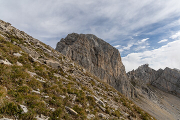 Fototapeta premium Scenic alpine mountains near the Col de la Colombière in the Bornes-Aravis massif with green meadows and rugged peaks, Haute-Savoie, French Alps