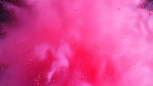Vibrant pink powder explosion creating a stunning visual effect against a dark background. Ideal for creative projects and dynamic presentations