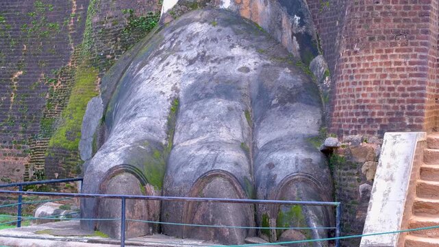 Large lions paw statue at base of Lion Rock Sigiriya rock fortress in Sri Lanka
