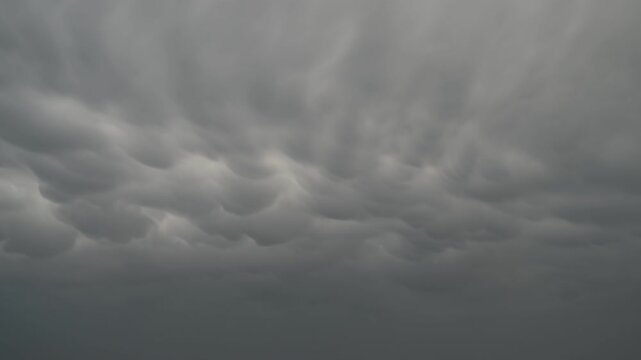 Time-lapse view of dark unique storm clouds in the sky.
