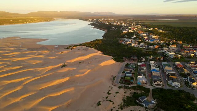 Abstract textures of coastal town Witsand sand dunes at sunrise, aerial view