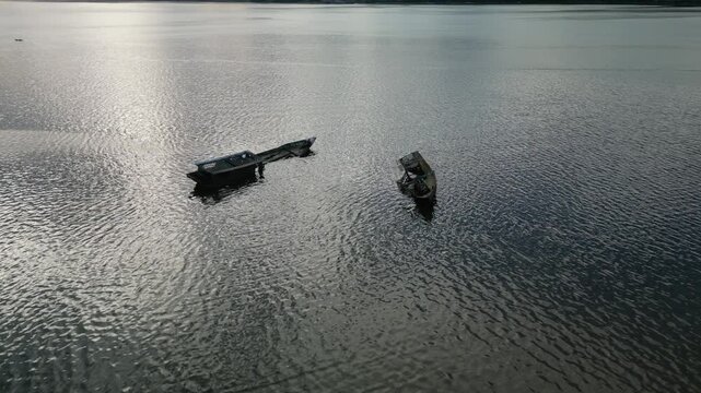 aerial view of two old boat in bay