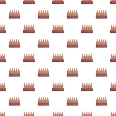 Fototapeta premium Wine bottles contained in crates forming a repeating pattern on a white background